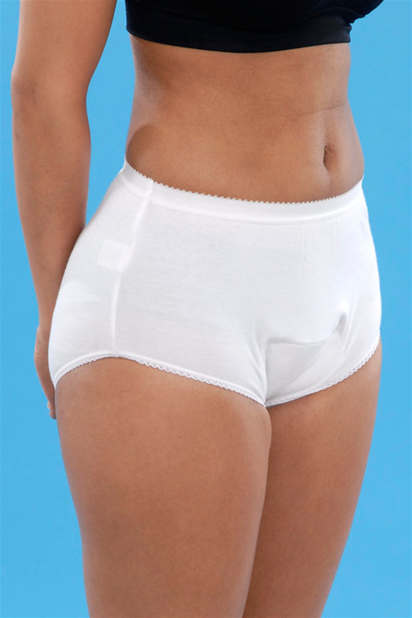 Washable pants with integral pad