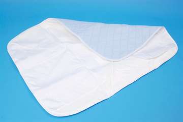 Washable bed pad with integral waterproof backing